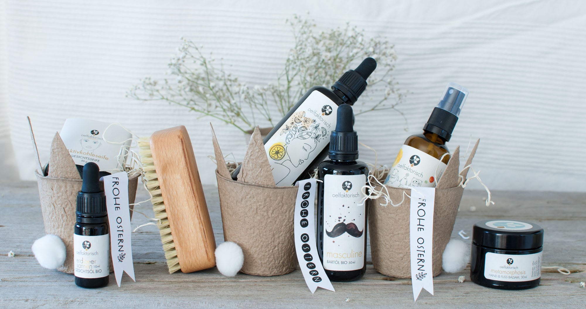 Osternester mit Auswahl von oelfaktorisch Produkten Aktivkohleseife Erdbeersamenöl Yuzu Körperöl Bartöl Raumspray Handcreme oelfaktorisch Körperöle